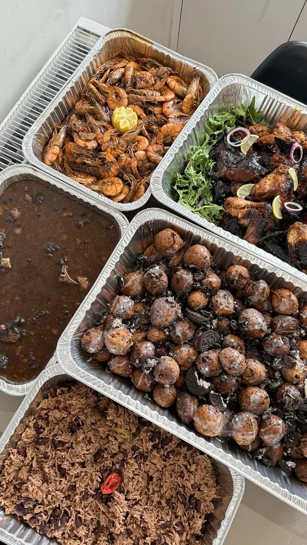 Foil trays of wings, puff puff and stew
