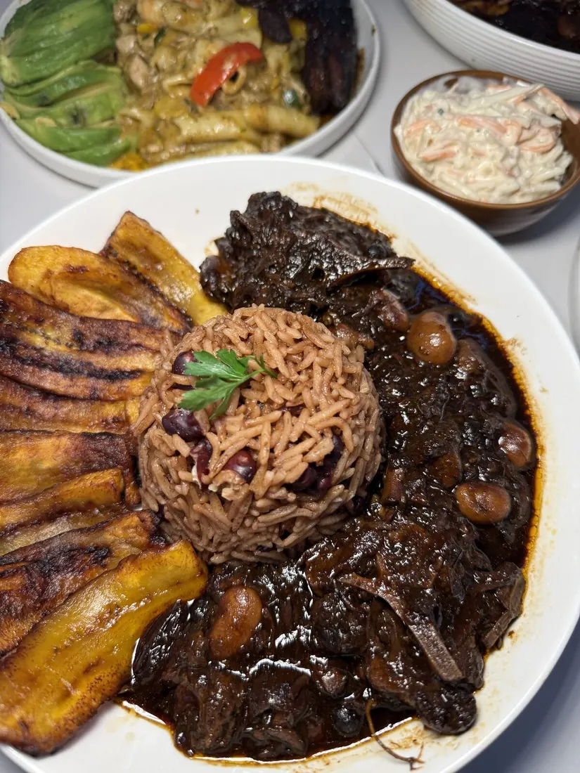 Oxtail with rice and peas and fried plantain
